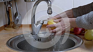 Woman Hands Turn on Water, Washes Red Apple, Turn off the Tap.