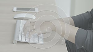 Woman hands typing on a computer keyboard (Slog)