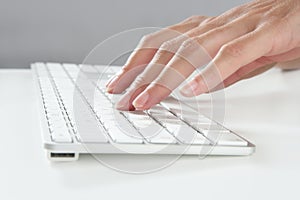 Woman hands typing keyboard