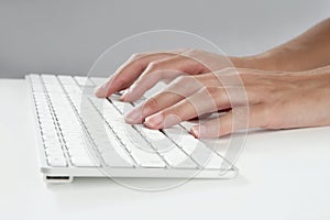 Woman hands typing keyboard