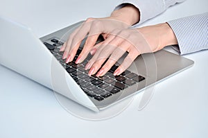 Woman hands typing laptop