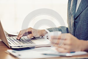 Woman hands typing in a laptop