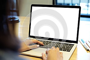 Woman hands typing laptop computer with blank screen for mock up template background, top view, people business technology and