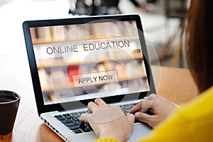 Woman hands typing laptop computer with online education on screen background, online learning, education concept