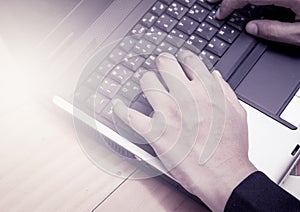 Woman hands typing on laptop keyboard