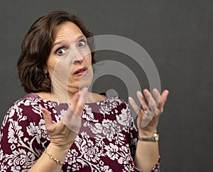 Woman with hands up with exasperated expression