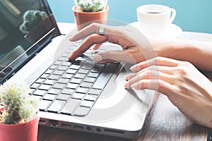 Woman hands using laptop computer, Workspace, Working at home