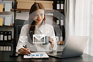 Woman hands using Laptop, tablet typing on keyboard and surfing the internet with email icon, email marketing concept, send e-mail