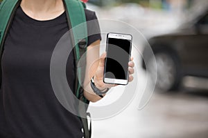 Woman hands using smartphone at city photo