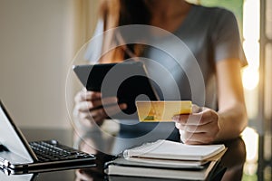 Woman hands using smartphone and holding credit card with digital layer  as Online shopping concept