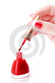 Woman hands and varnish bottle