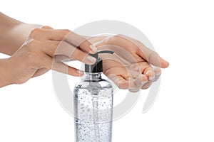 Woman hands, on White empty isolated background using hand sanitizer Large transparent bottle dispenser alcohol gel, coronavirus