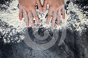 Woman hands working with bakery flour and drawing heart shape on the table. baking background, banner, menu, recipe place for text