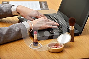 Woman hands working on laptop