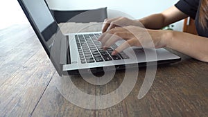 Woman hands working and typing on laptop or computer notebook keyboard