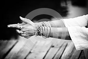 Woman hands in yoga symbolic gesture mudra bw