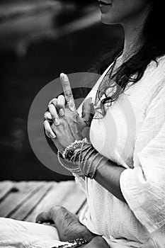 Woman hands in yoga symbolic gesture mudra bw