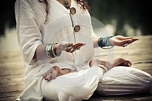 Woman hands in yoga symbolic gesture mudra