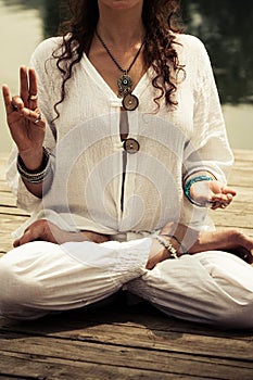 Woman hands in yoga symbolic gesture mudra