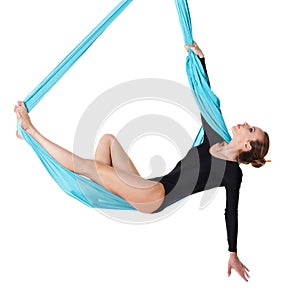 Woman hanging in aerial silk