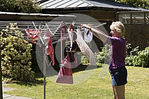 Woman hanging washing out to dry