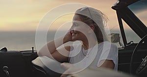 Woman, happy and car adventure at sunset, freedom and smile on road trip, relax and journey. Female person, breeze and