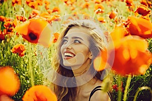 Woman or happy girl in field of poppy seed