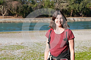 Woman happy middle aged cute smiling walking lake river sea side