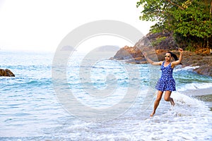 Woman happy in morning in Lonely Beach