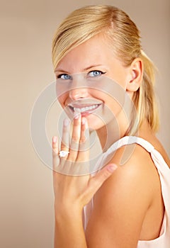 Woman, happy and wedding ring in studio portrait with smile for proposal, engagement or commitment by background. Girl