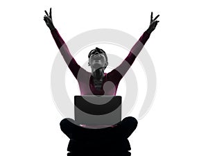 Woman happy winning computing laptop computer silhouette