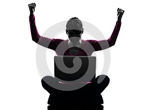 Woman happy winning computing laptop computer silhouette