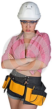 Woman in hard hat, protective glasses and tool