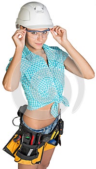 Woman in hard hat, tool belt and protective