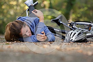 woman has fallen from bicycle and hurt elbow