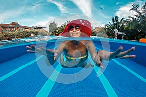 Woman has a fun in swimming pool