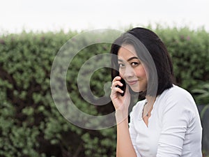 Woman has a good happy mobile phone conversation.