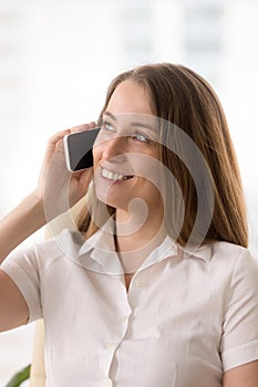Woman has pleasant conversation on cellphone