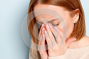 Woman has problem with contact lenses, rubbing her swollen eyes due to pollen, dust allergy. Dry eye syndrome