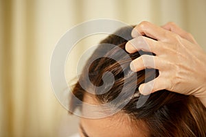 A woman has problems with hair and scalp,she has dandruff from allergic reactions to shampoos.