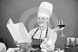 Woman hat and apron study culinary arts. Culinary expert. Chef cooking healthy food. Girl read book best culinary