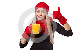 Woman in hat with cup and thumb up