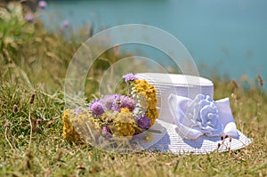 Woman Hat with flowers on the grass