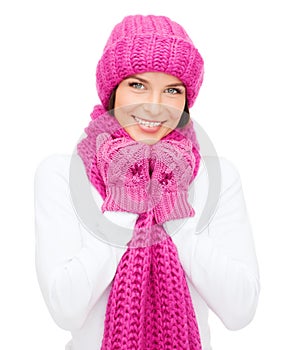 Woman in hat, muffler and mittens