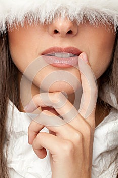 Woman with a hat pulled down over the eyes