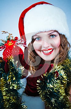 Woman in and hat of Santa with a christmas ball
