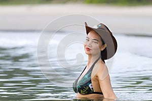 Woman and hat sexsy bikini on beach