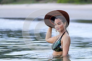 Woman and hat sexsy symbol bikini on beach