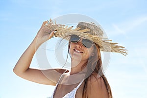 Woman with hat and sunglasses