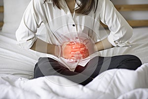 woman have bladder or uti pain with vaginal problem sitting on bed in bedroom